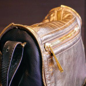 Shimmering gold and black handbag